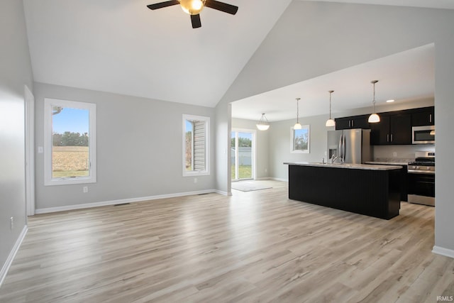 living room featuring ceiling fan, light hardwood / wood-style flooring, and high vaulted ceiling