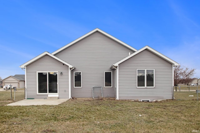 rear view of property with a patio area and a yard