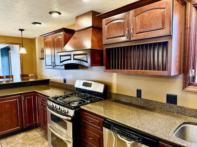 kitchen featuring custom exhaust hood, dark stone counters, hanging light fixtures, a textured ceiling, and appliances with stainless steel finishes