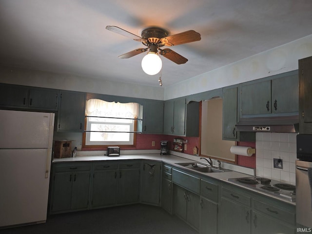 kitchen featuring ceiling fan, sink, white appliances, and tasteful backsplash