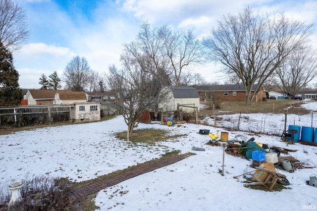 view of yard covered in snow