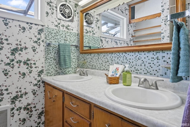 bathroom featuring backsplash and vanity