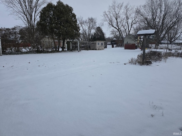 view of yard layered in snow