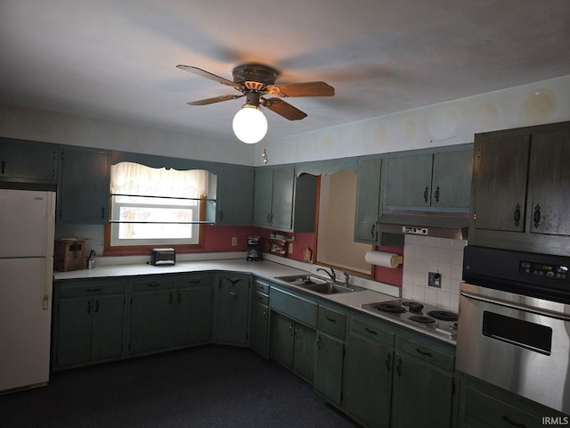 kitchen with sink, ceiling fan, white appliances, and backsplash