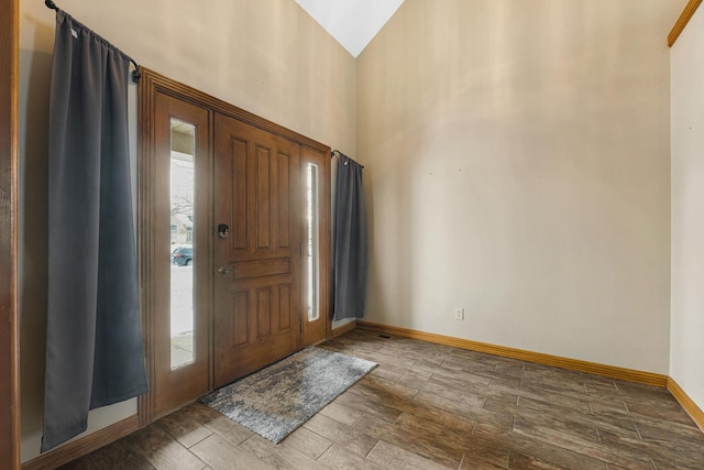 entryway featuring vaulted ceiling and a healthy amount of sunlight