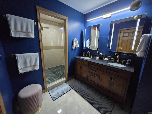 bathroom featuring tile patterned flooring, vanity, and walk in shower