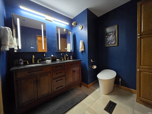 bathroom with tile patterned flooring and vanity