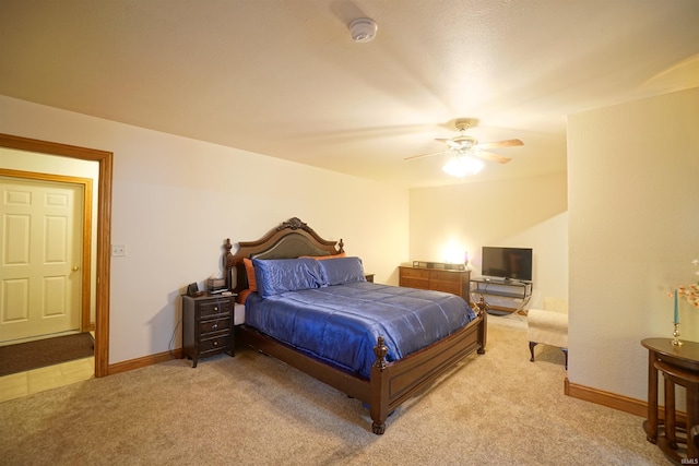 bedroom with ceiling fan and light colored carpet