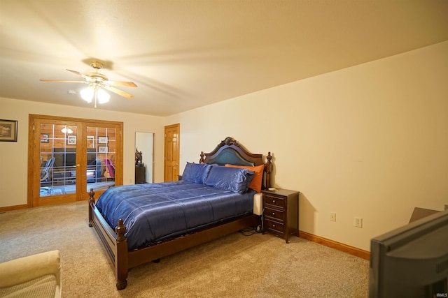 carpeted bedroom with access to outside, ceiling fan, and french doors