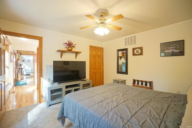 bedroom featuring ceiling fan and light hardwood / wood-style flooring