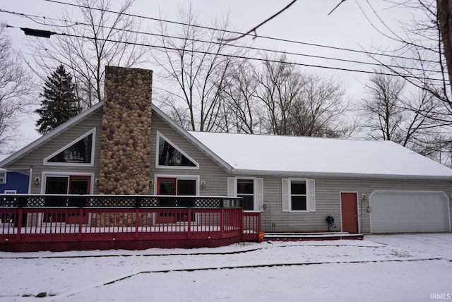 view of front of home with a garage and a deck