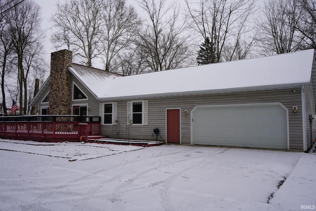 view of front of home featuring a garage and a deck