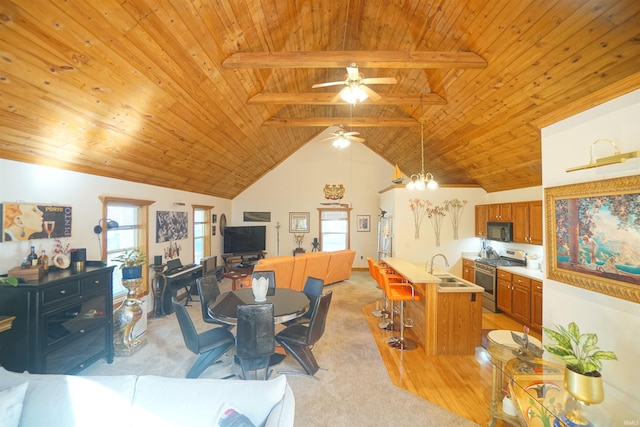 dining space with beam ceiling, a wealth of natural light, and wooden ceiling