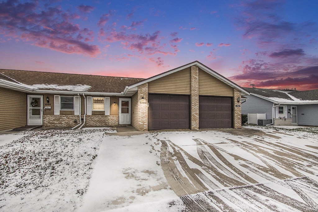 ranch-style home with a garage