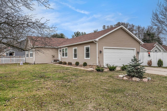 view of front of home with a garage and a front yard