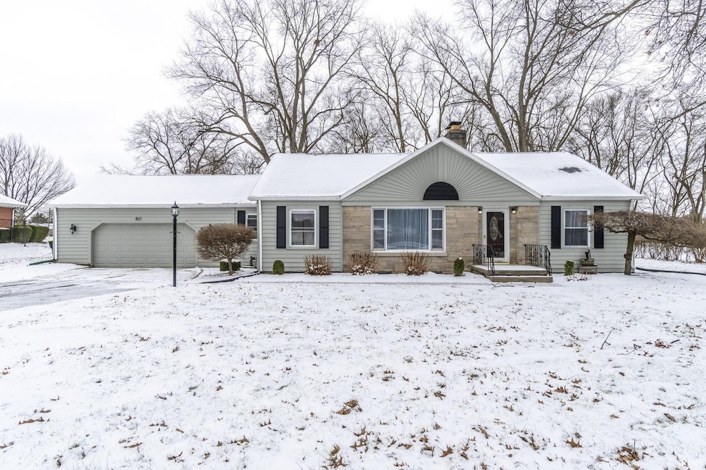 ranch-style home with a garage