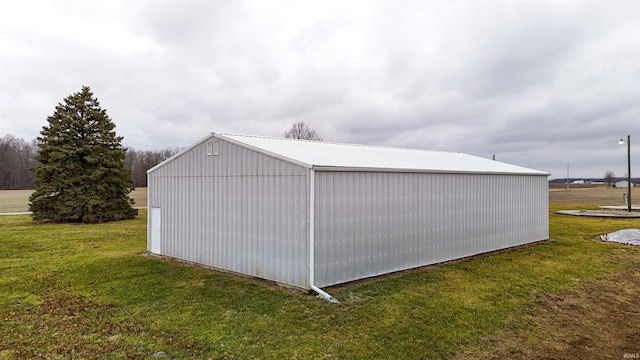 view of outdoor structure with a yard