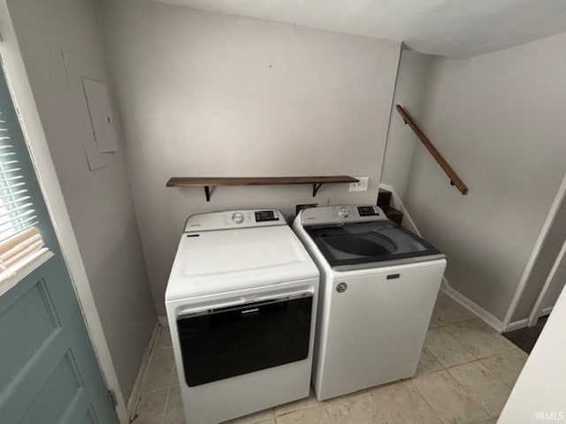 clothes washing area with washer and clothes dryer