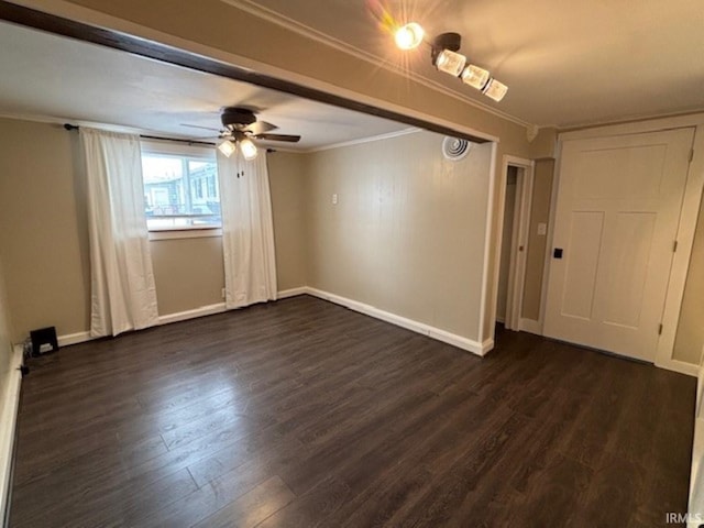 empty room with dark hardwood / wood-style floors, ceiling fan, and crown molding