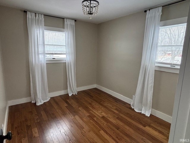 unfurnished room featuring dark hardwood / wood-style floors