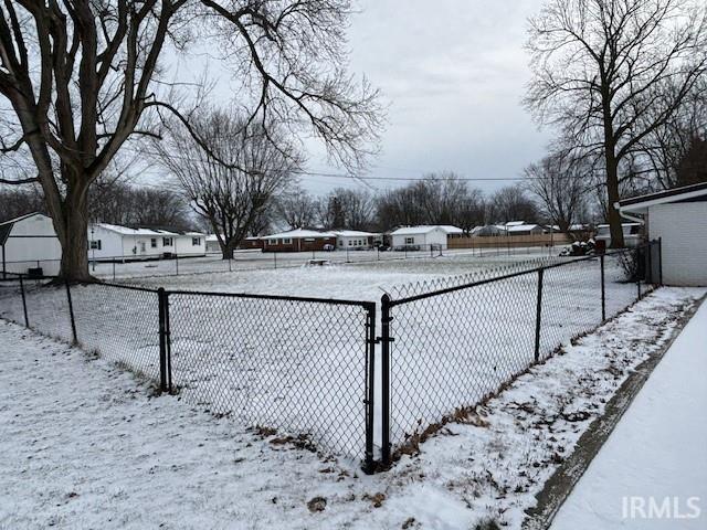 view of yard layered in snow