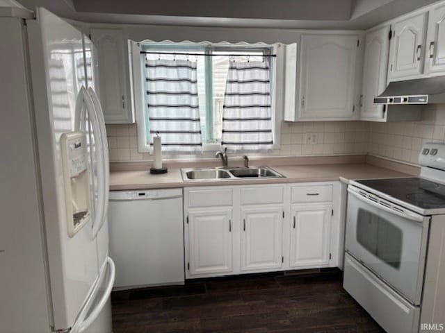 kitchen featuring backsplash, white appliances, sink, dark hardwood / wood-style floors, and white cabinetry