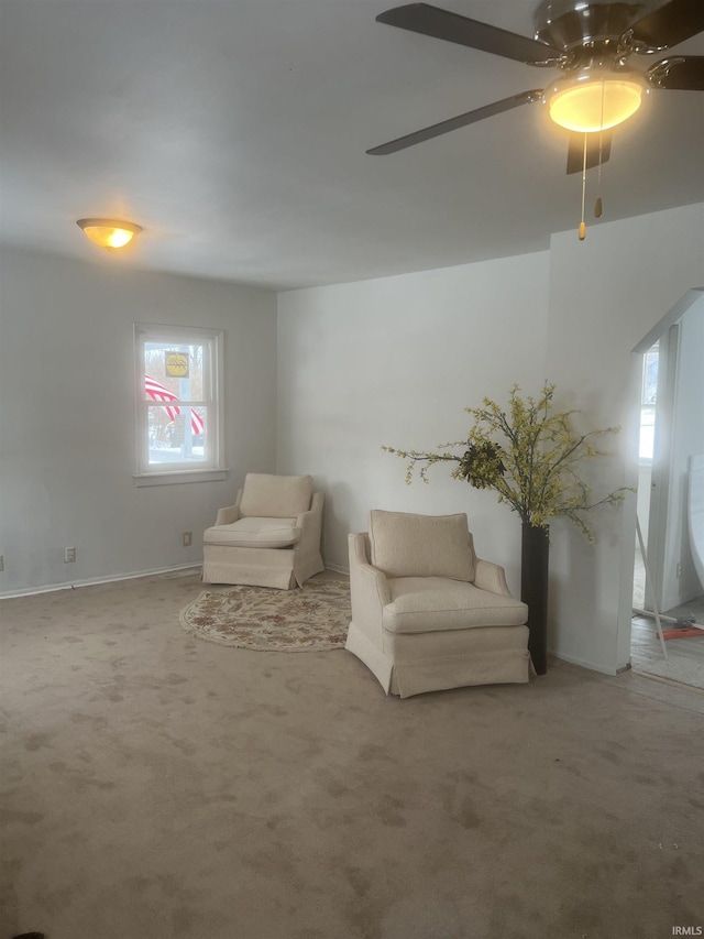 unfurnished room with carpet flooring and ceiling fan