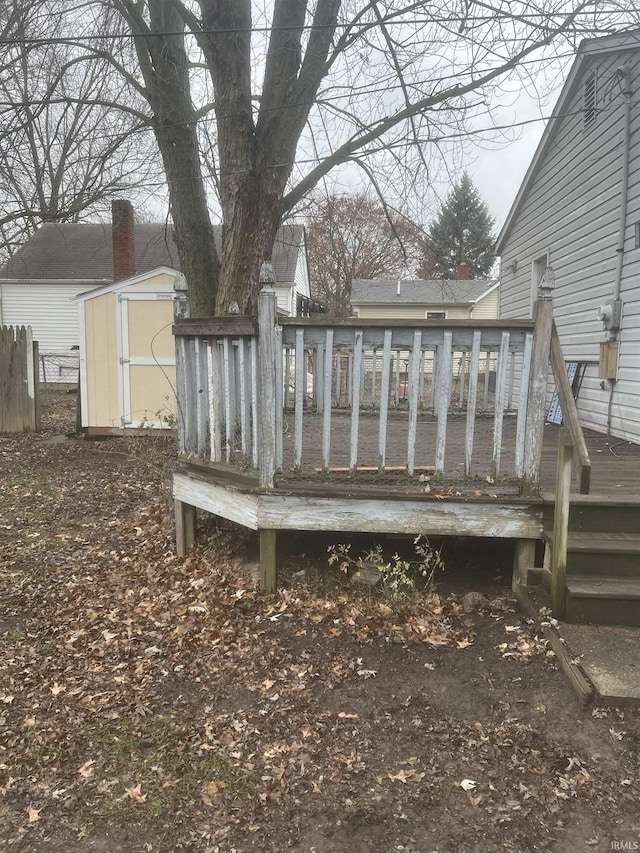 wooden deck featuring a storage shed