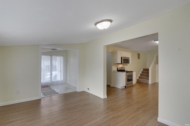 unfurnished room featuring light wood-type flooring