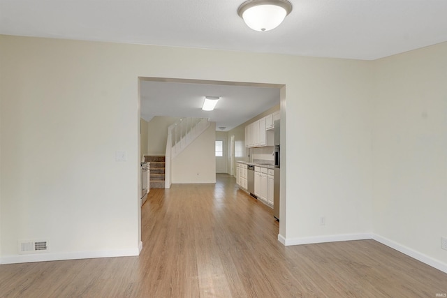 unfurnished room featuring light wood-type flooring