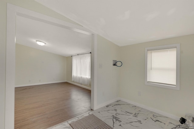 spare room with light wood-type flooring