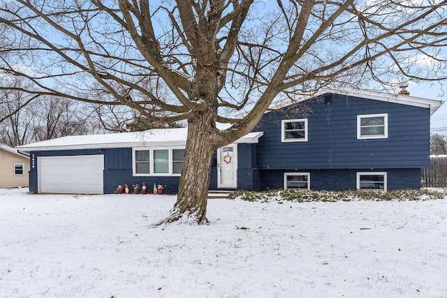 split level home featuring a garage