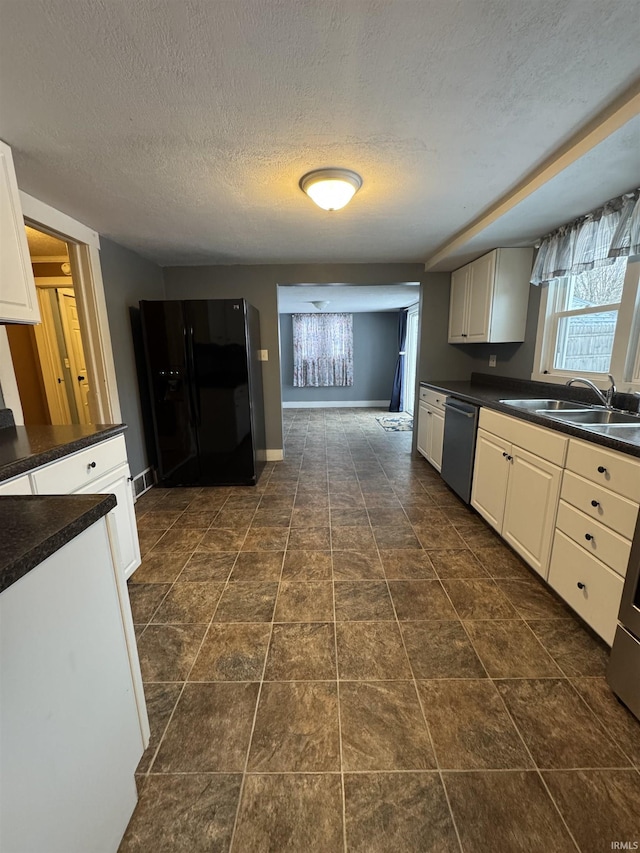 kitchen featuring sink, stainless steel dishwasher, a textured ceiling, black fridge with ice dispenser, and white cabinetry