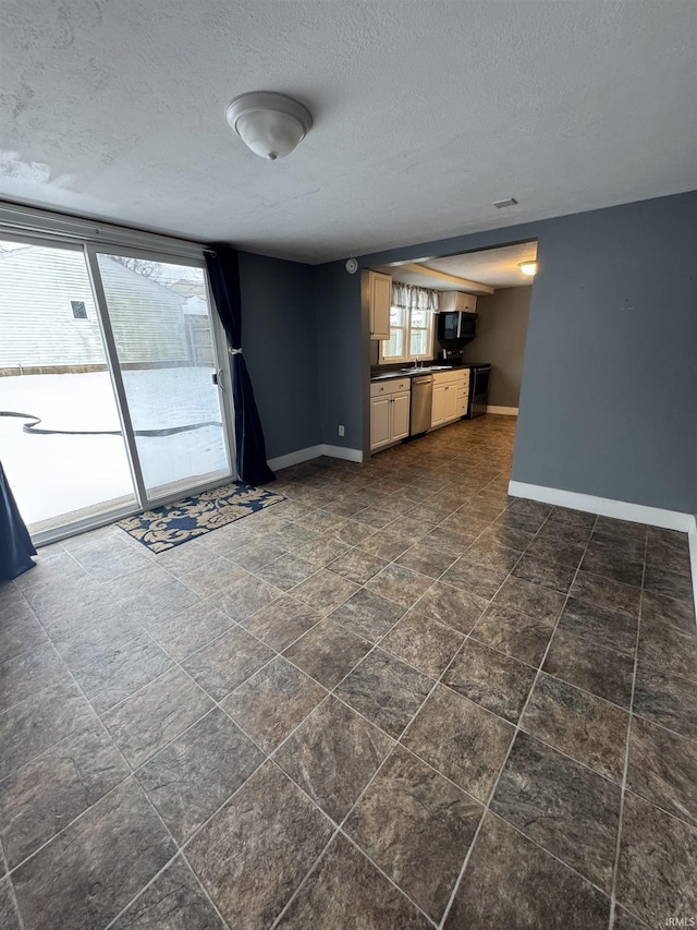 unfurnished living room with a textured ceiling