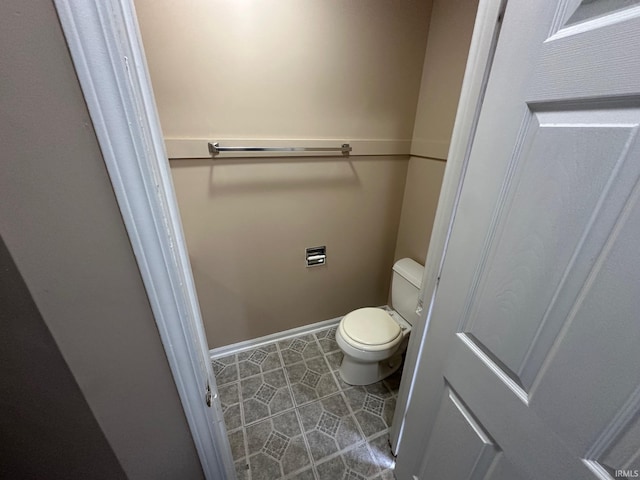 bathroom featuring tile patterned flooring and toilet