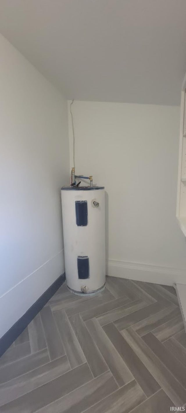 utility room featuring water heater