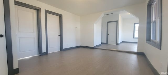 spare room with dark wood-type flooring