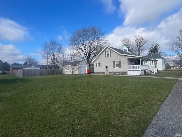 view of property exterior featuring a lawn, a garage, covered porch, and an outdoor structure