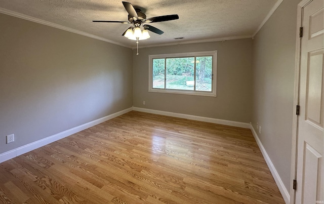 spare room featuring a textured ceiling, light hardwood / wood-style flooring, ceiling fan, and ornamental molding