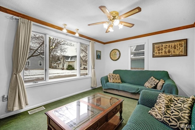 living room with carpet floors, plenty of natural light, crown molding, and ceiling fan