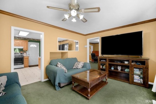 living room with crown molding, ceiling fan, and light carpet