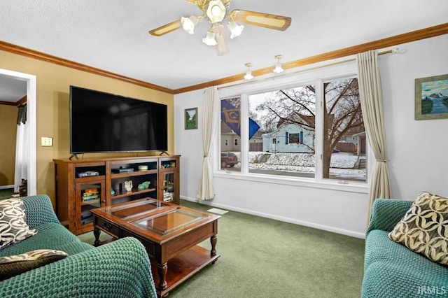 carpeted living room with ceiling fan and ornamental molding