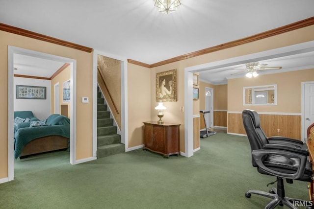 office space featuring carpet, ceiling fan, and crown molding