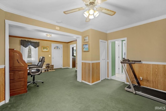 carpeted home office featuring ceiling fan and crown molding