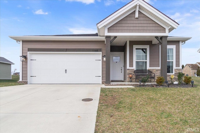 view of front of house featuring a garage and a front lawn