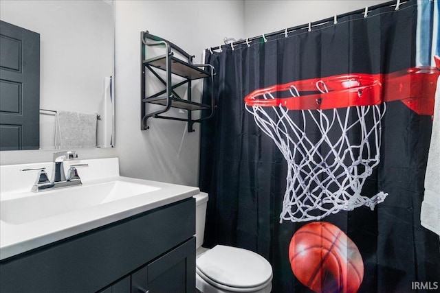 bathroom featuring vanity, a shower with shower curtain, and toilet