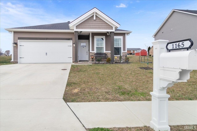 view of front facade featuring a garage and a front lawn