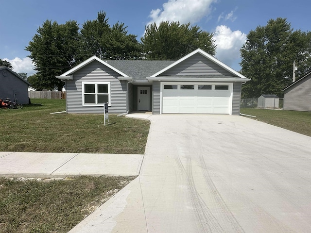 ranch-style home with a front yard and a garage