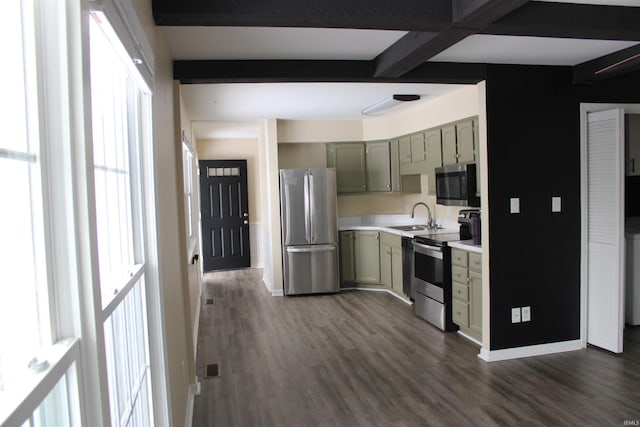 kitchen featuring dark wood-type flooring, sink, beamed ceiling, and stainless steel appliances