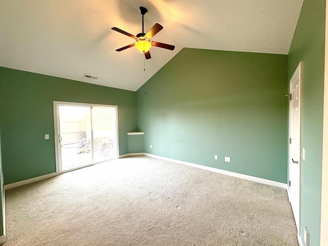 unfurnished room with ceiling fan, light colored carpet, and vaulted ceiling